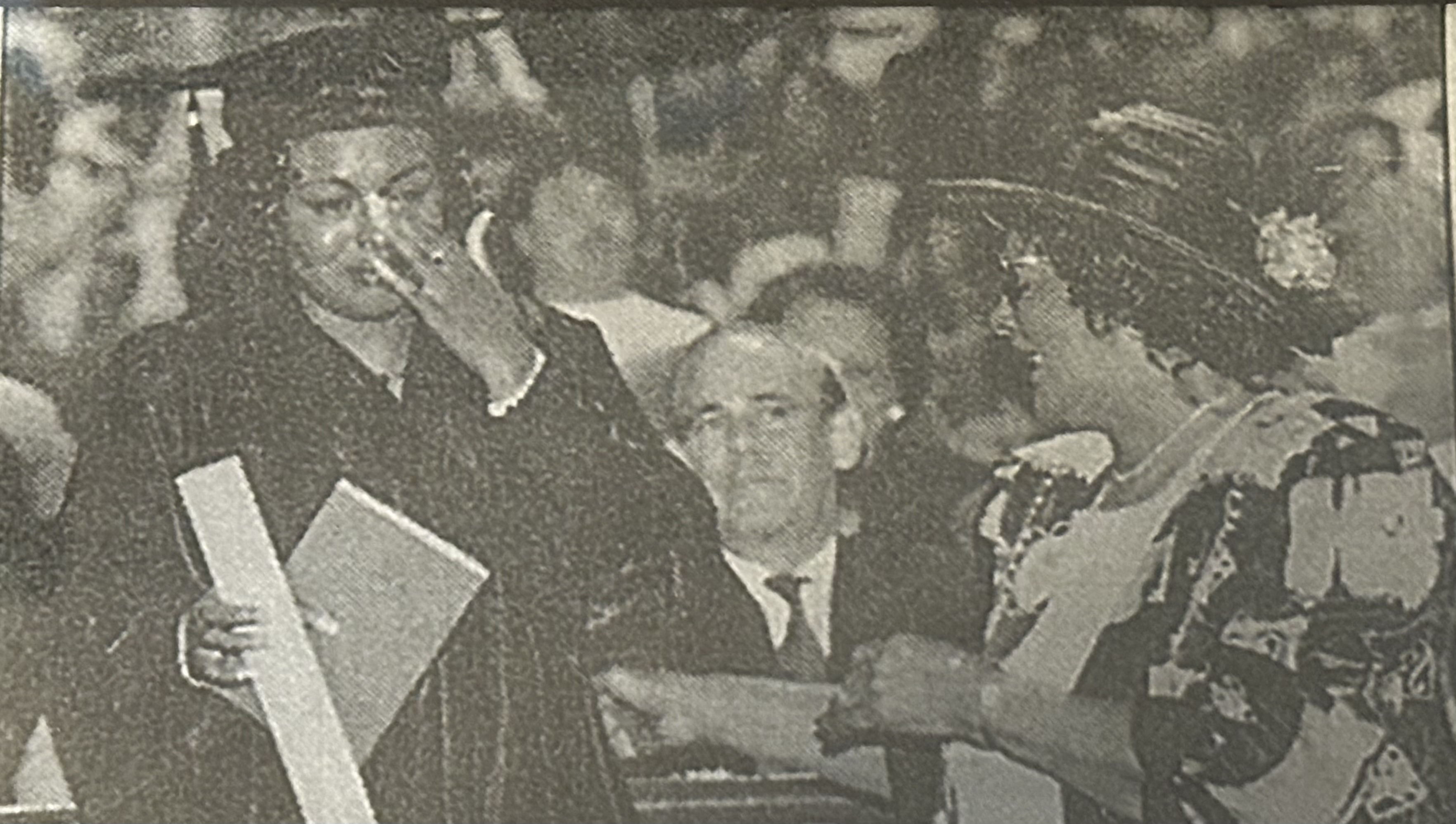 Tracy Sanders being greeted by her grandmother after crossing the stage as the 50,000th graduate of UNC Charlotte