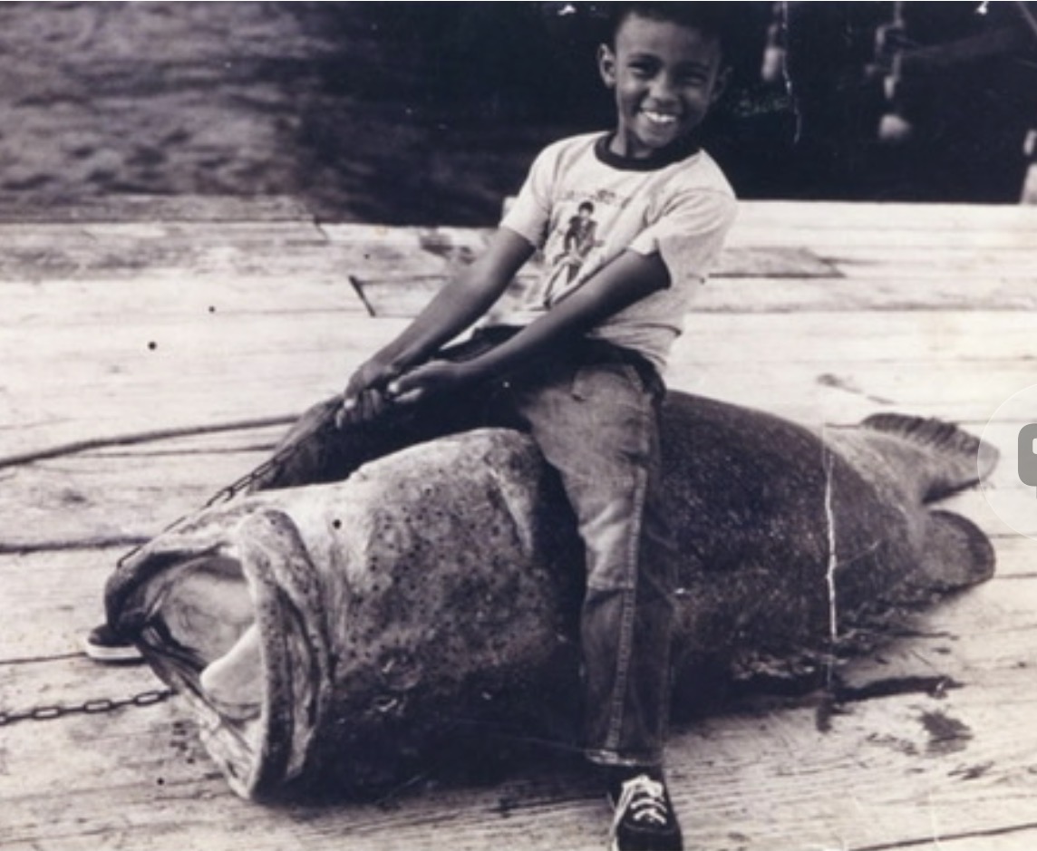 My uncle Johnny as a boy, sitting on a Goliath grouper caught by my grandfather off the Phosphate Dock in Boca Grande, circa 1956
